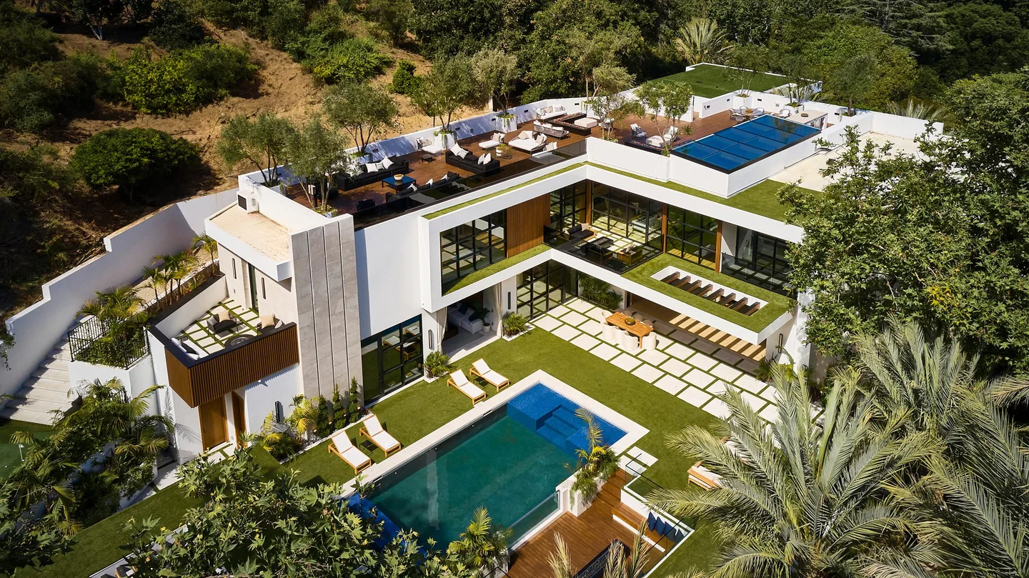 Aerial view of the residence, planted roofs, rear pool and terraced garden.