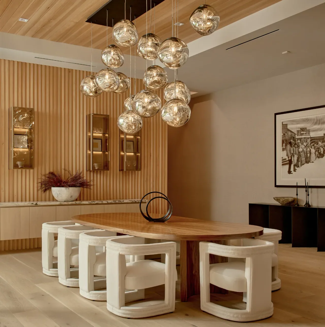 Dining area beneath clustered pendant lights at Chalon Road.
