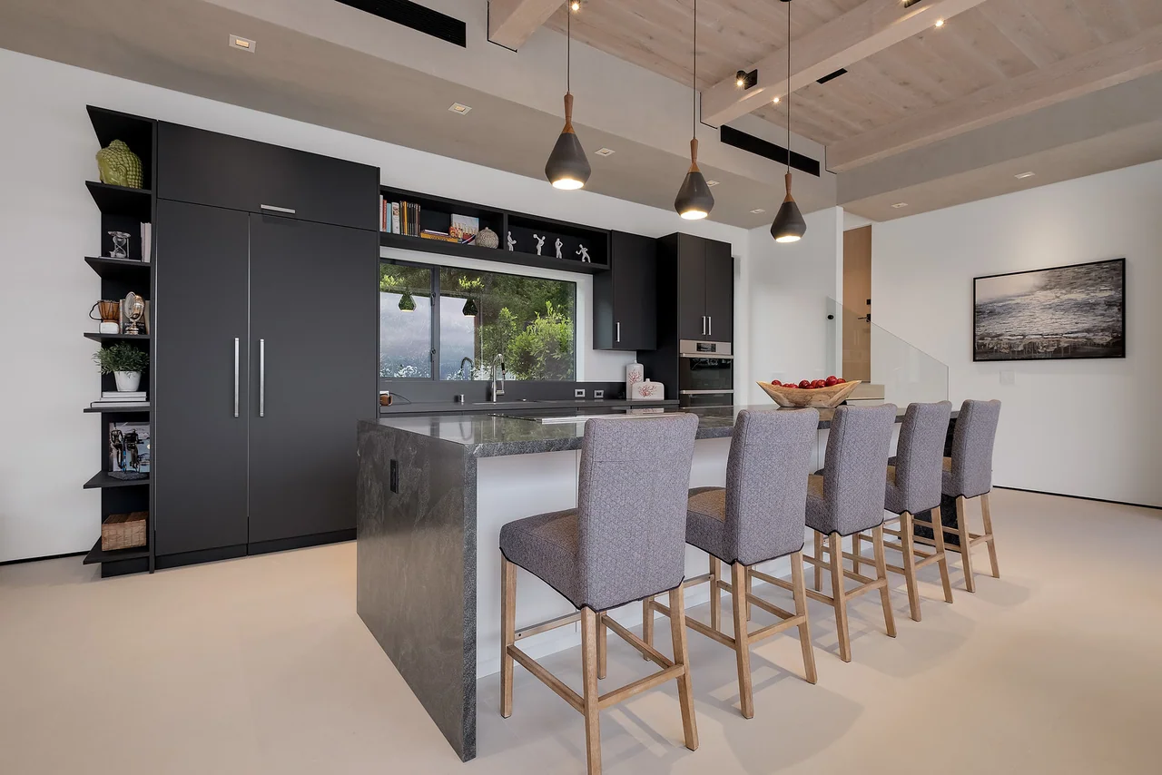 Kitchen island beneath pendant lights at Dixie Canyon.