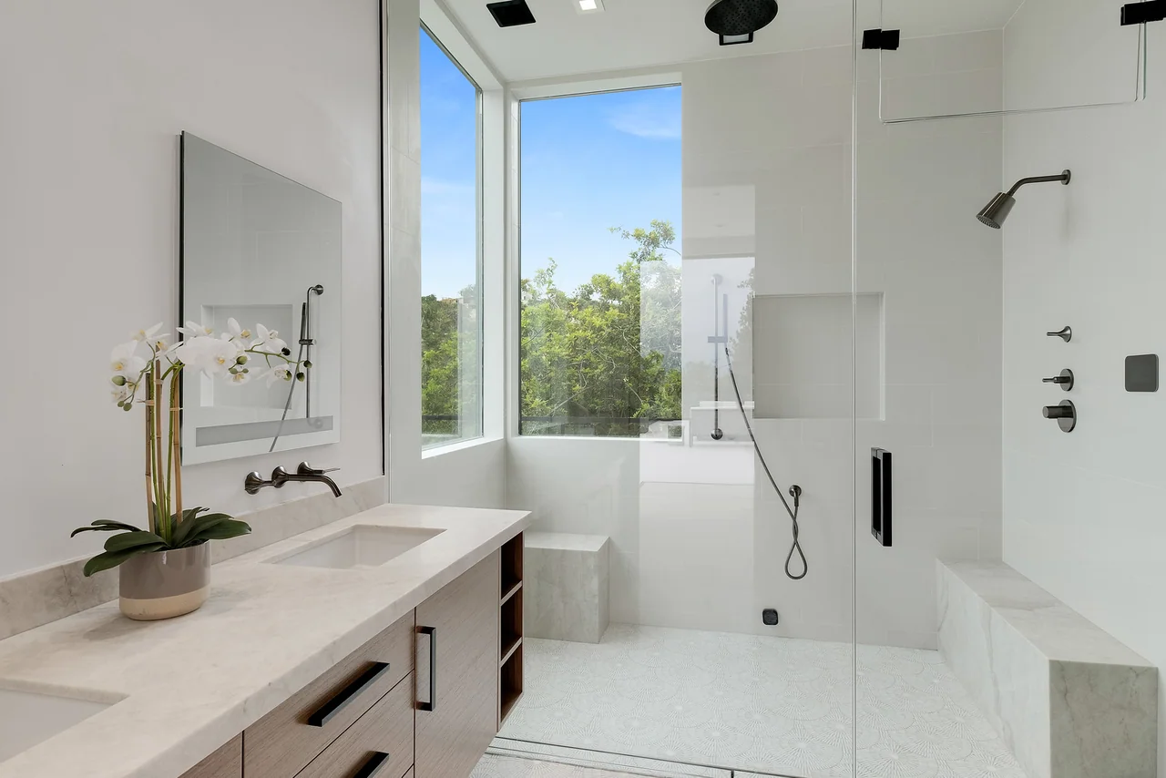 Bathroom vanity beside tall windows at Dixie Canyon.