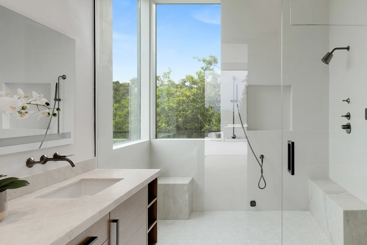 Glass shower beside a window at Dixie Canyon.