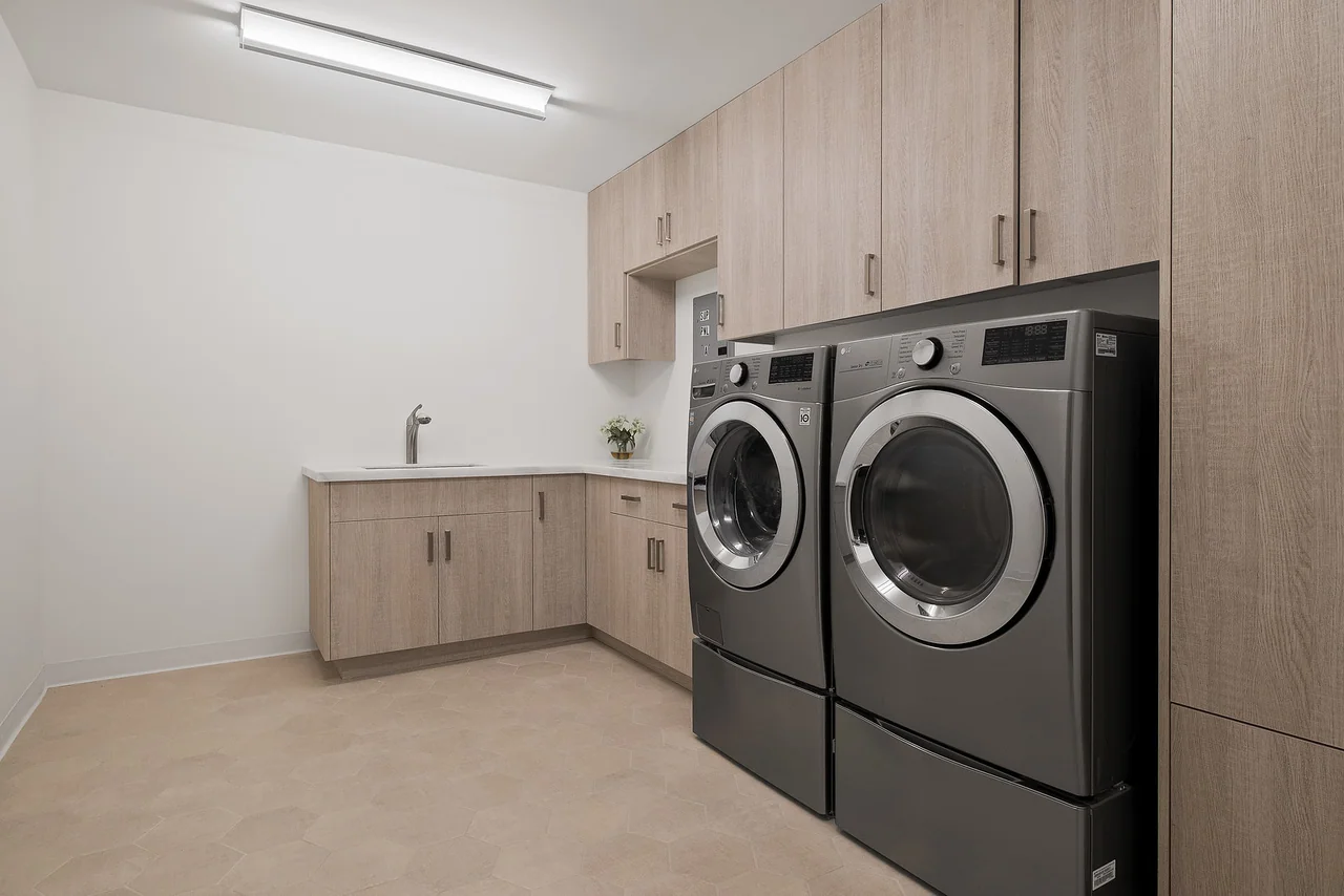 Laundry room with fitted cabinets at Dixie Canyon.