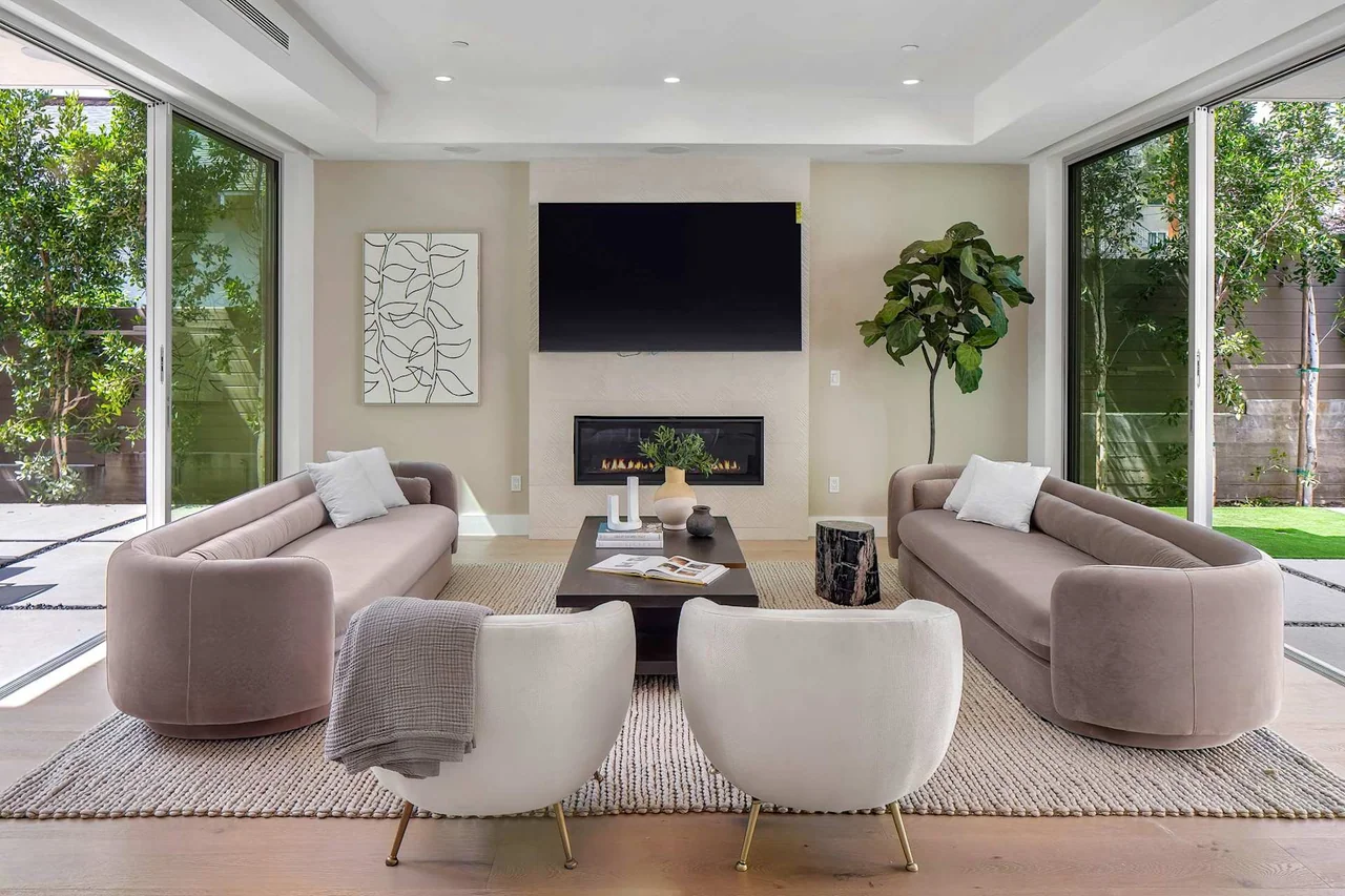 Fireplace wall with paired windows at Fairburn Avenue.