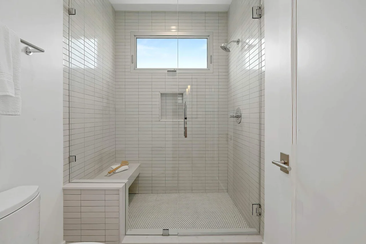 Tiled shower and recessed shelf at Fairburn Avenue.