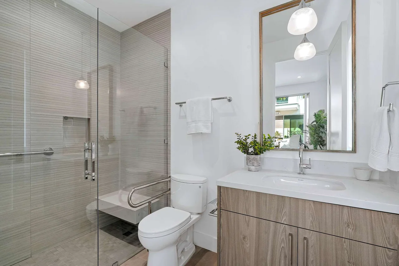 Vanity beside a glazed shower at Fairburn Avenue.