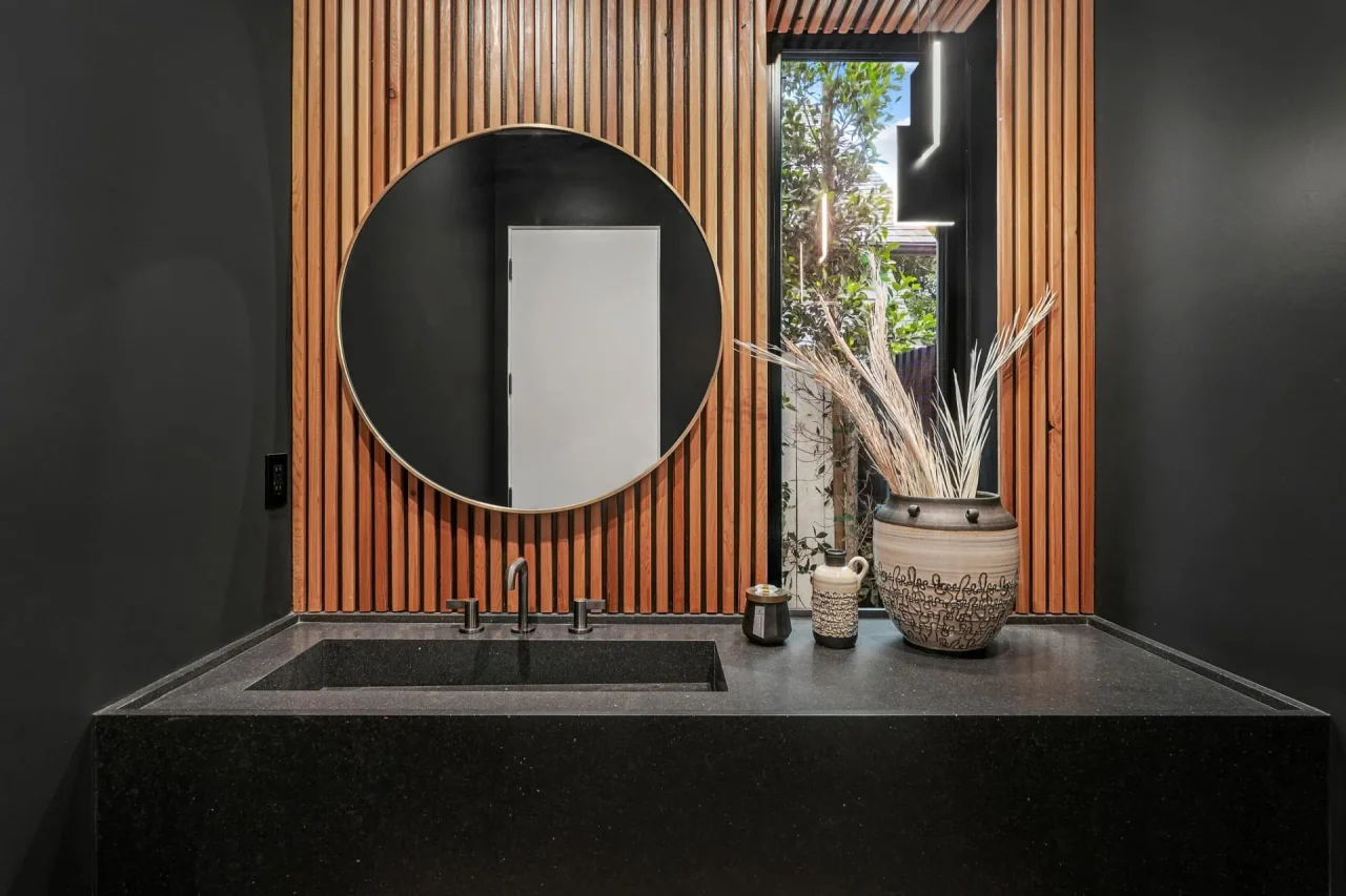 Powder room with ribbed timber wall at Nowita Place.