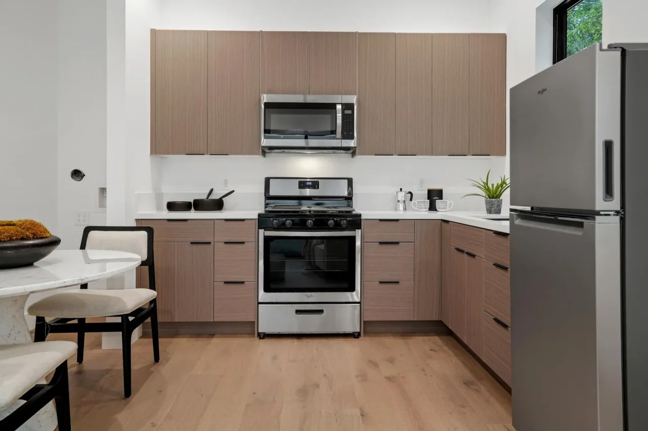 Kitchenette with timber cabinets at Nowita Place.