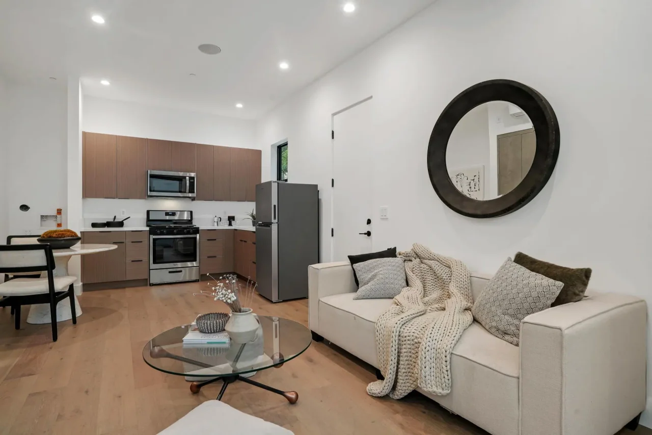 Sitting room opening toward the kitchen at Nowita Place.