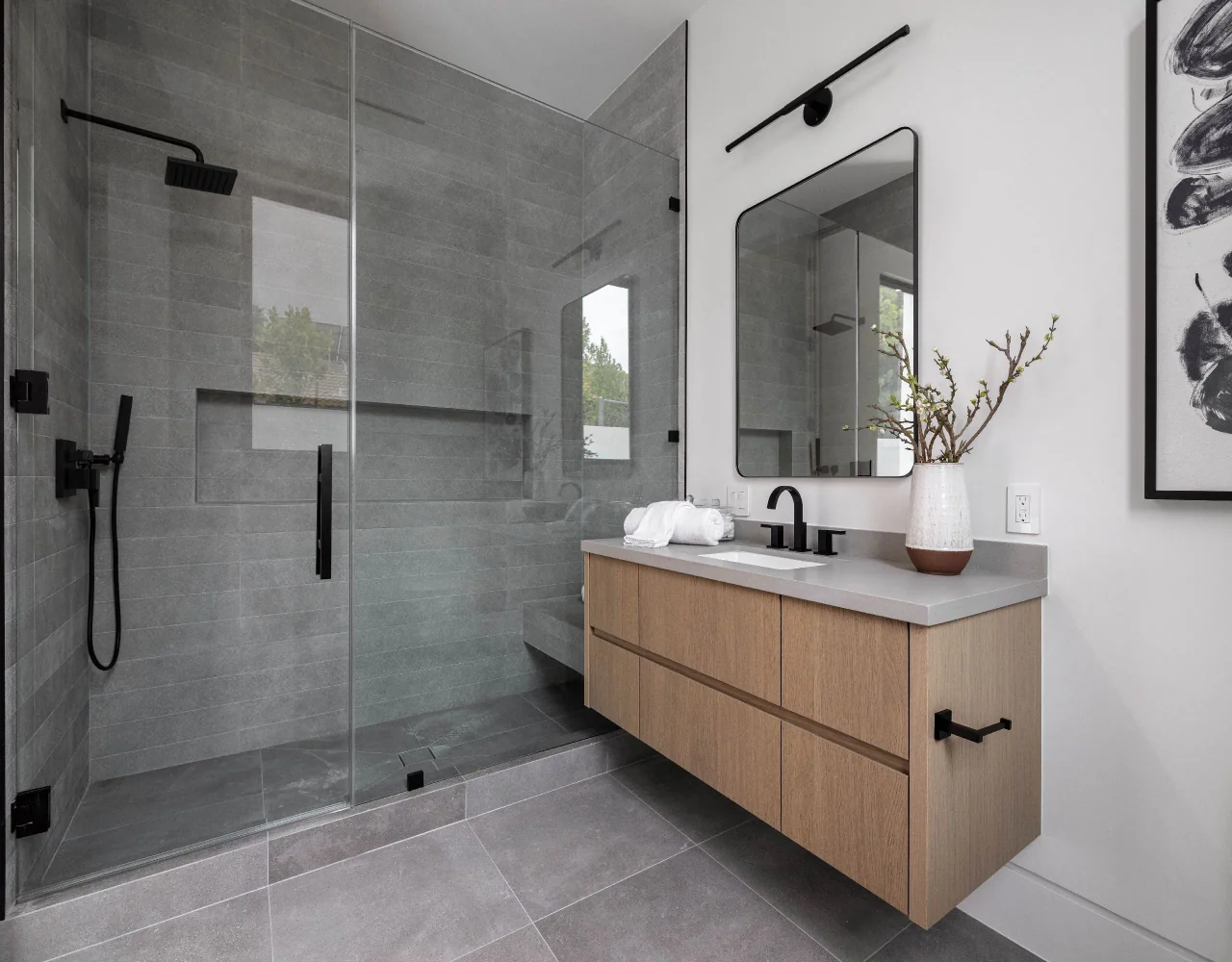 Bathroom vanity and glass shower at Petit Avenue.