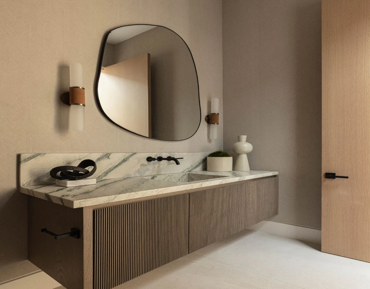 Powder room with ribbed vanity front at Petit Avenue.