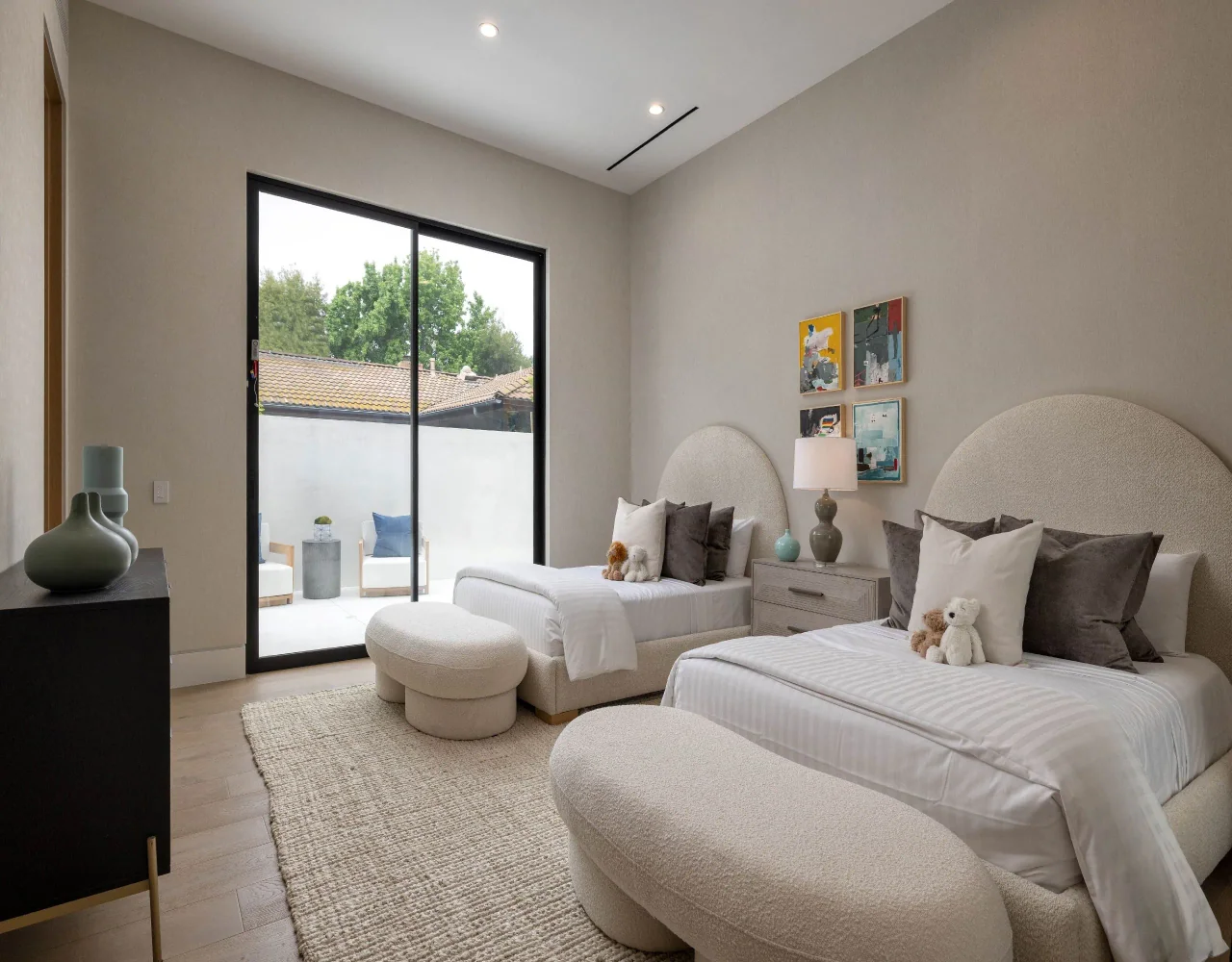 Bedroom opening to a walled courtyard at Petit Avenue.