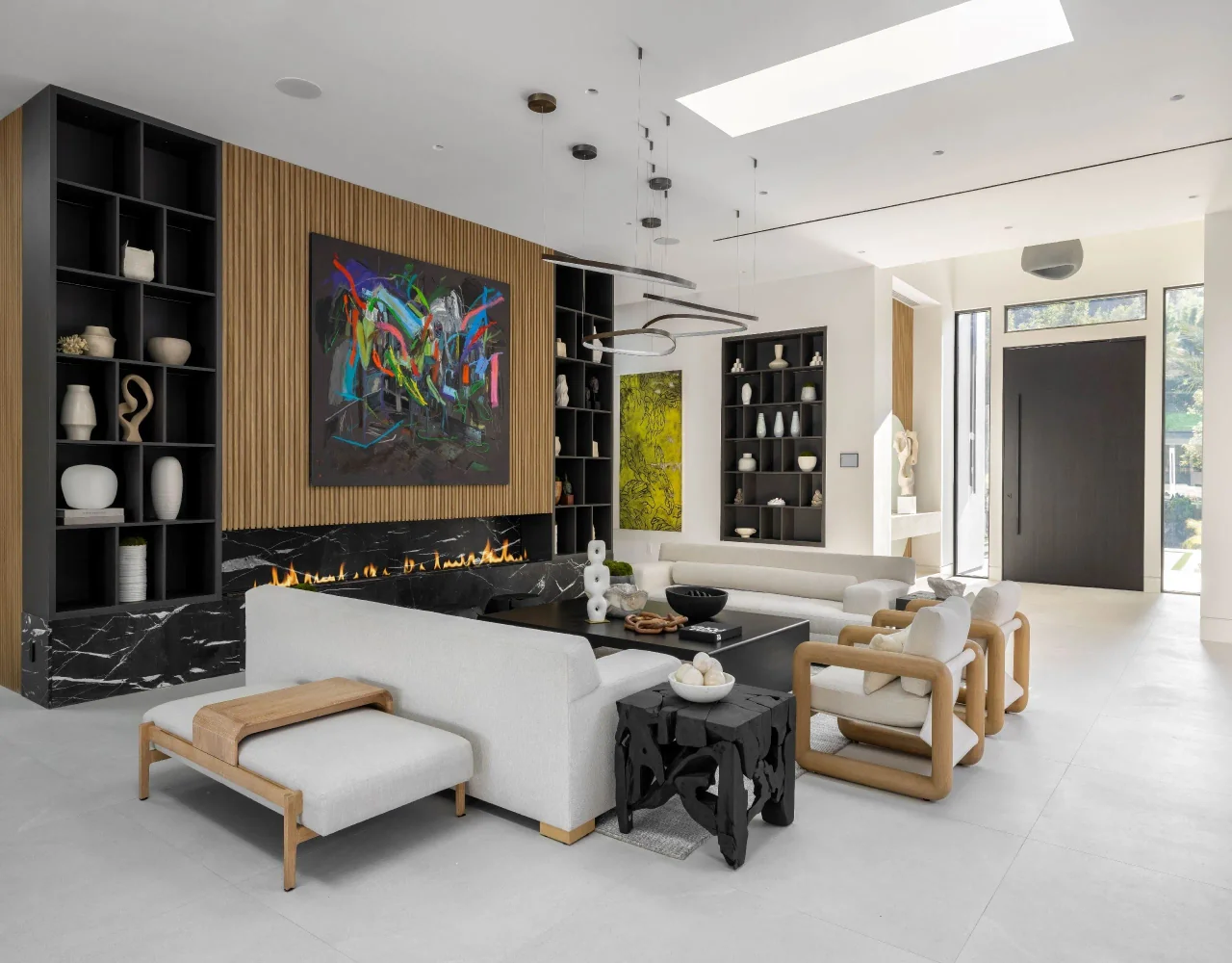 Living room beside tall shelving at Petit Avenue.