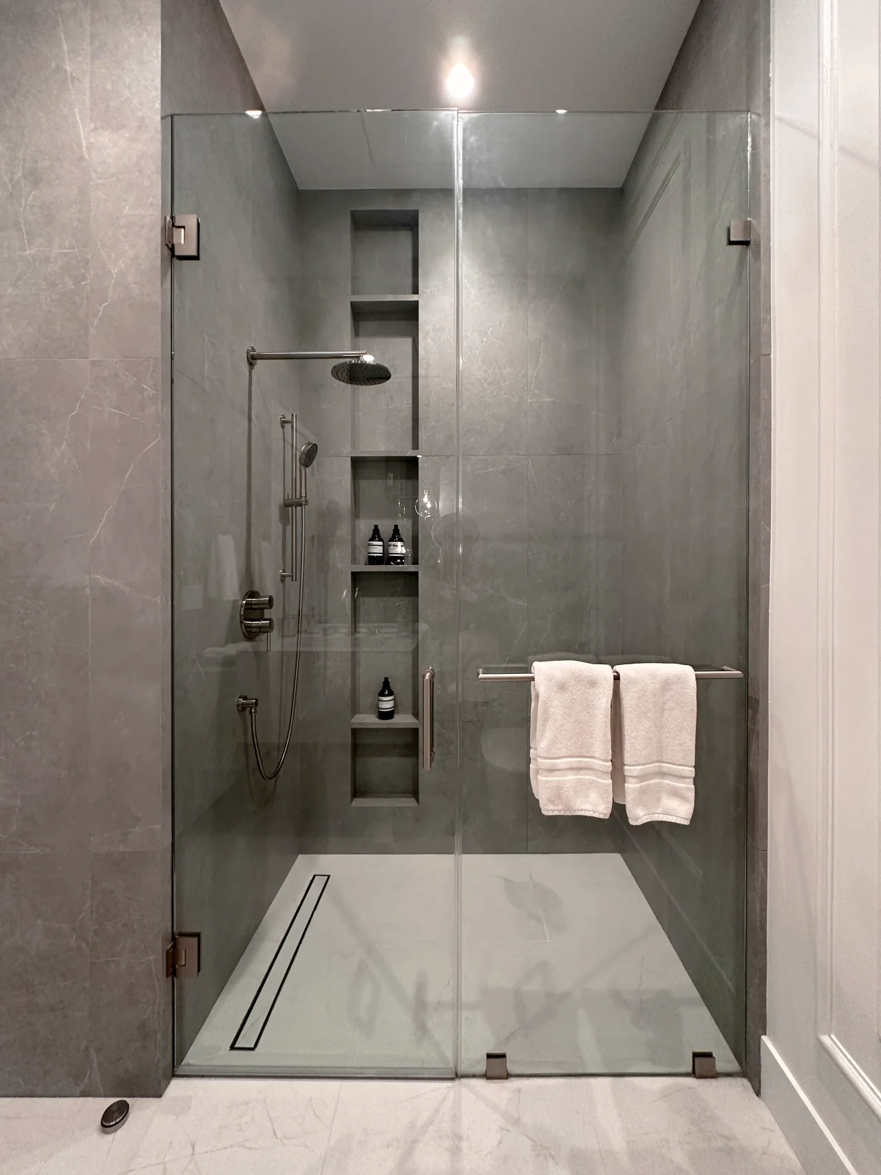 Walk-in shower and recessed storage at Rio Flora Place.