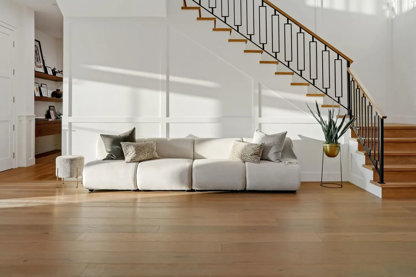 South Bundy timber stair with a dark geometric balustrade and timber handrail above a pale living area.