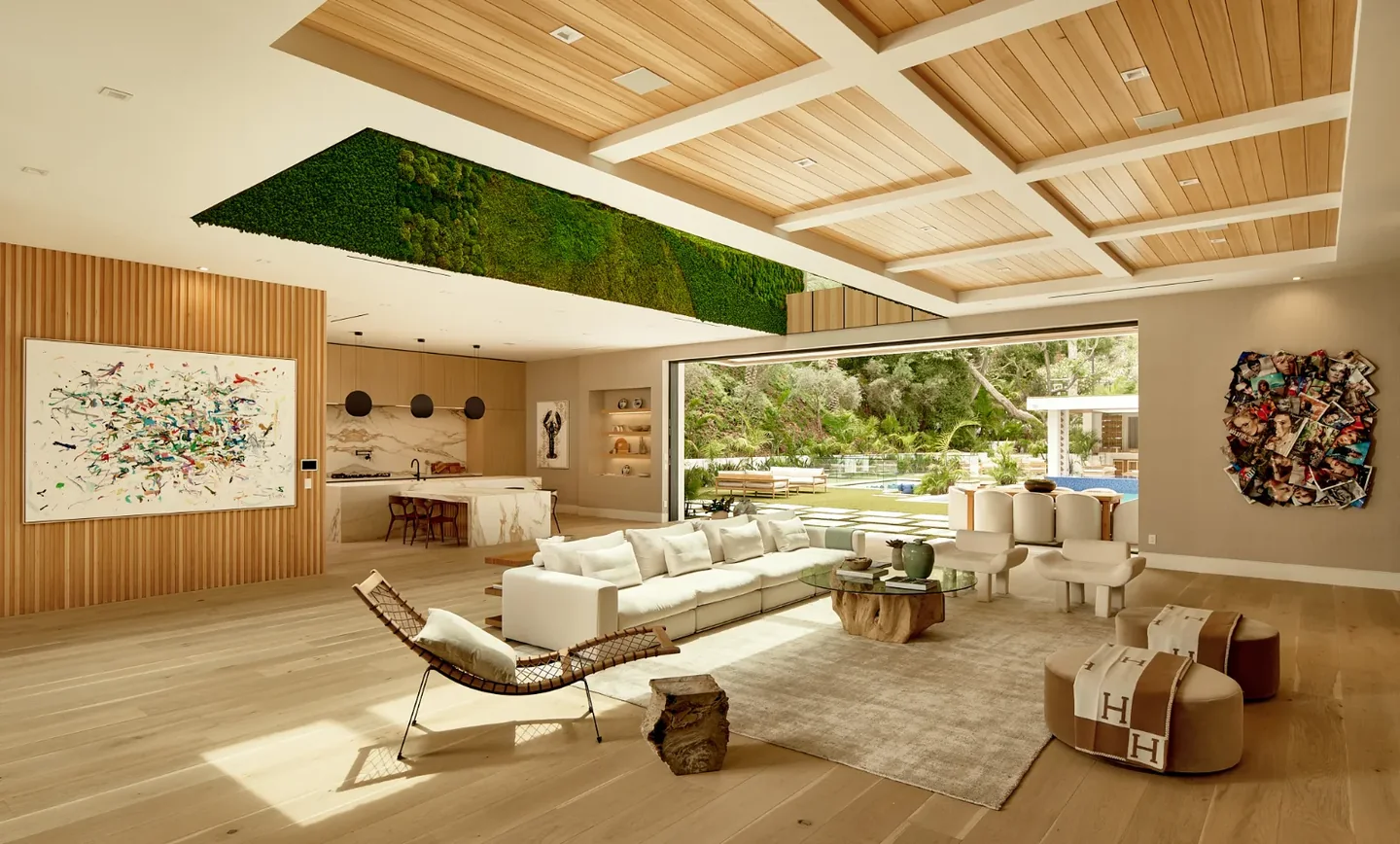 Chalon Road living room with a timber and white ceiling grid, pale floors and a broad garden opening.