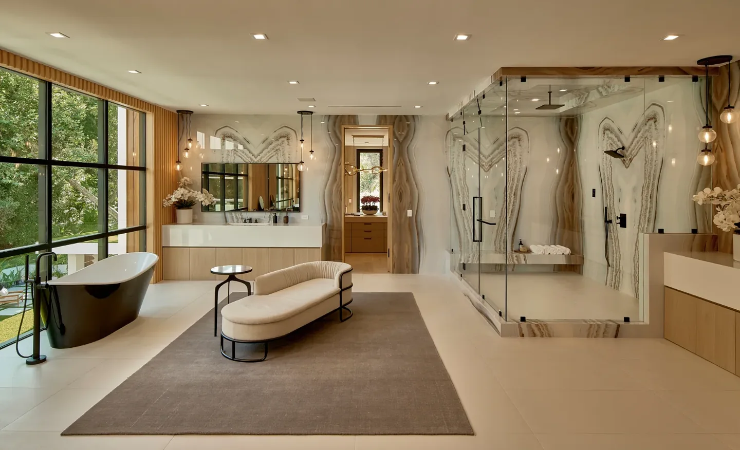 Chalon Road bathroom with broad glazing, a freestanding bath, glazed shower and long vanity.